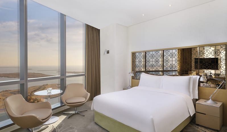 Superior Room with Sea View Bedroom at Conrad Abu Dhabi Etihad Towers by Kenwood Travel