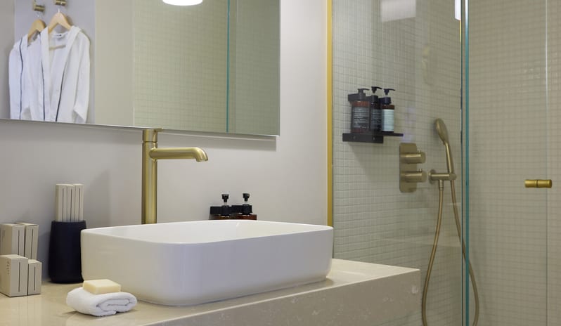 Infinite Sea View Escape Bedroom Modern luxury bathroom featuring a white vessel sink at Aulūs Chania, Curio Collection by Hilton by Kenwood Travel