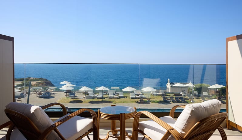 Infinite Sea View Escape Bedroom Private terrace view of an oceanfront at Aulūs Chania, Curio Collection by Hilton by Kenwood Travel