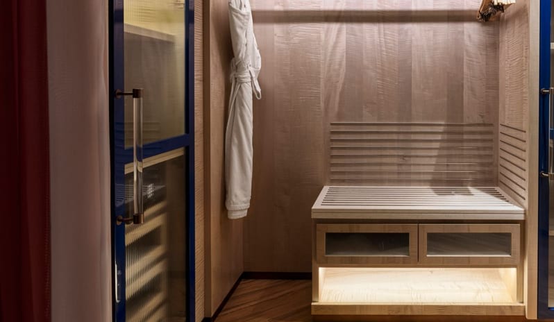 Spacious walk-in wardrobe in a luxury guest room featuring wood-paneled walls at W Dubai - Mina Seyahi by Kenwood Travel