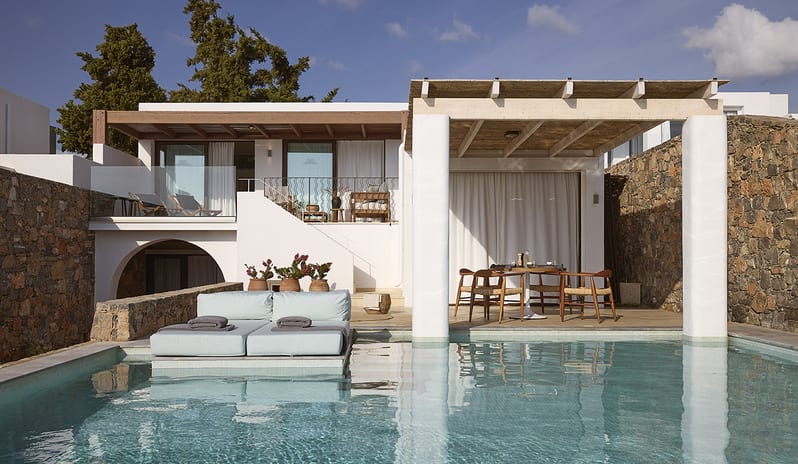 Three Bedroom Thalassa Villa Private Pool Seafront private infinity pool, a poolside sunbed, and a shaded outdoor dining area under a pergola at St.Nicolas Bay Resort by Kenwood Travel
