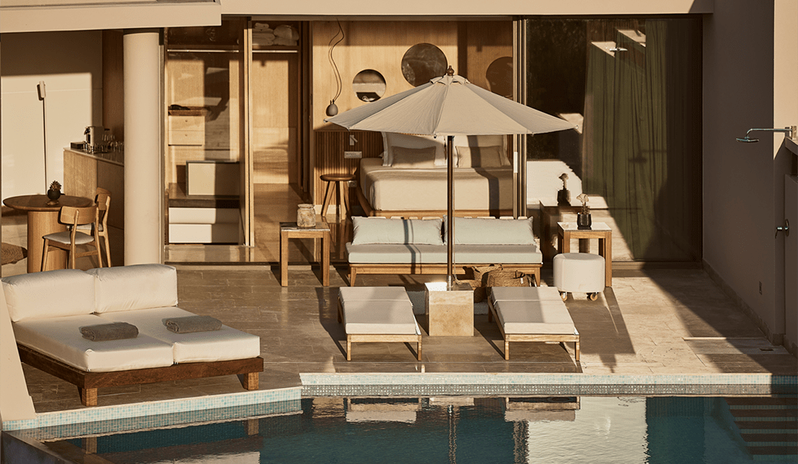 Olives & Sea 3-Bedroom Villa Private Pool Harbour View/Sea View private infinity pool, sunbeds with plush cushions, a large patio umbrella, and a seamless view into the modern master bedroom suite at St.Nicolas Bay Resort by Kenwood Travel