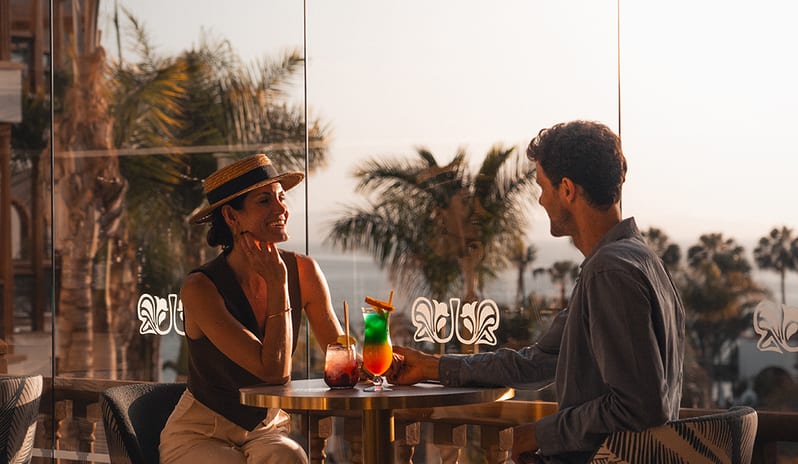 Nighttime view of the Lobby Bar terrace with illuminated arches and palm trees at Princesa Yaiza Suite Hotel Resort in Europe Holidays by Kenwood Travel