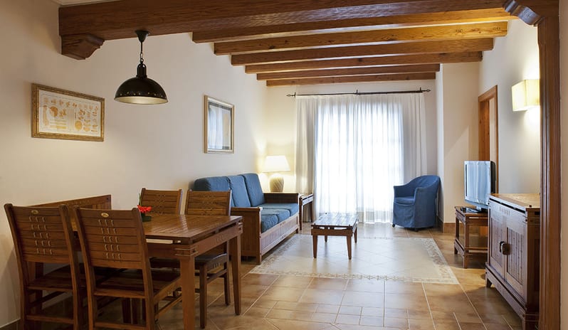 Dining Table With Living Area at Princesa Yaiza Suite Hotel Resort in Europe Holidays by Kenwood Travel