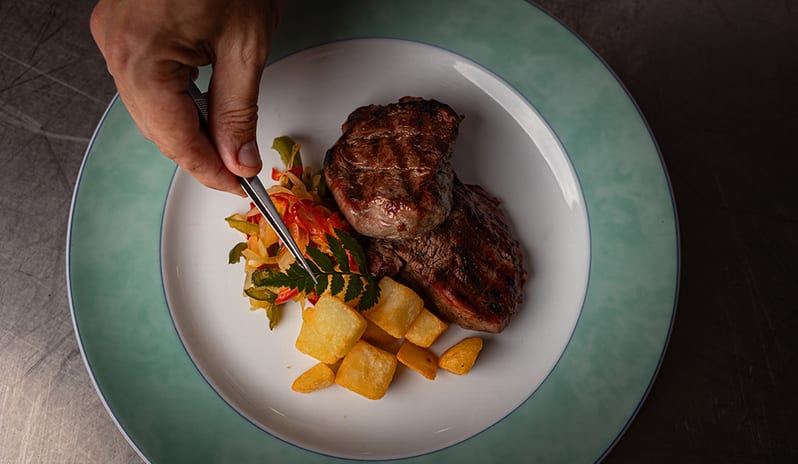Cozy table arrangement with blue accents inside the Yaiza Buffet at Princesa Yaiza Suite Hotel Resort in Europe Holidays by Kenwood Travel