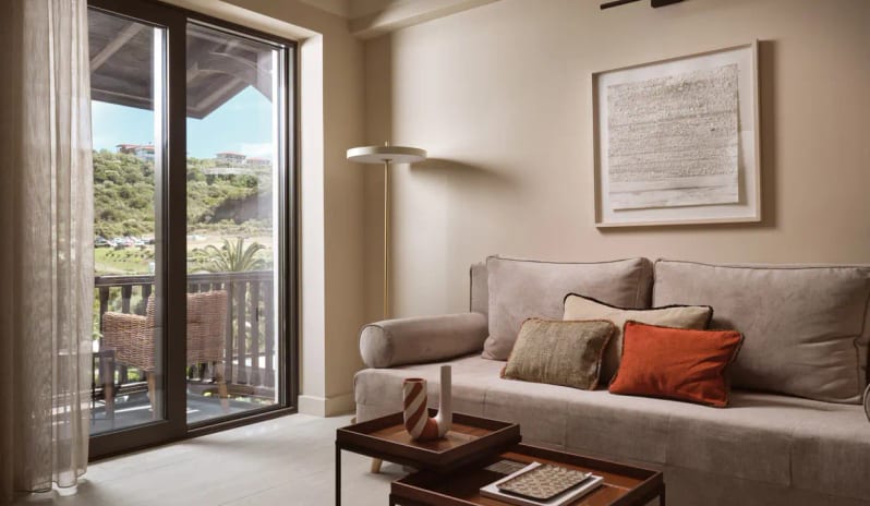 Deluxe Suite Garden View living area featuring warm ambient lighting, contemporary furniture, and elegant wood partitions at Eagles Palace by Kenwood Travel