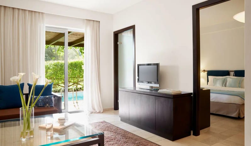 Suite Private Pool Nero private pool view, contemporary living area, and separate bedroom at Eagles Palace by Kenwood Travel