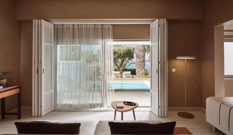 Bungalow Sea View Private Pool private pool, terrace, and olive trees through open shutters at Eagles Palace by Kenwood Travel