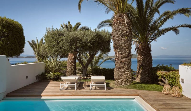 Bungalow Sea View Private Pool wooden decking, sun loungers, olive trees, and a panoramic view of the Aegean Sea at Eagles Palace by Kenwood Travel