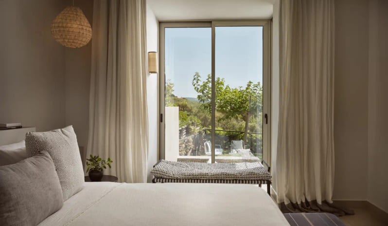 Residential 3 Bedroom Pool Villa Private Garden Sea View large sliding glass door opening to a private garden with trees and patio seating at Eagles Villas by Kenwood Travel