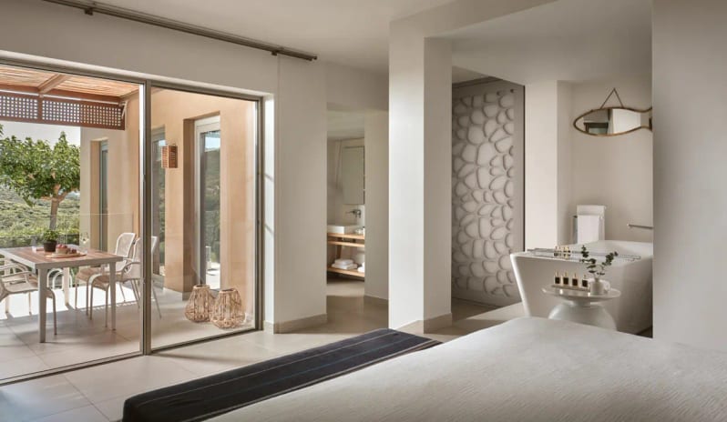 Residential 2 Bedroom Pool Villa Private Garden Sea View open-concept bedroom with a standalone bathtub, private pool access, and Mediterranean-inspired minimalist decor at Eagles Villas by Kenwood Travel