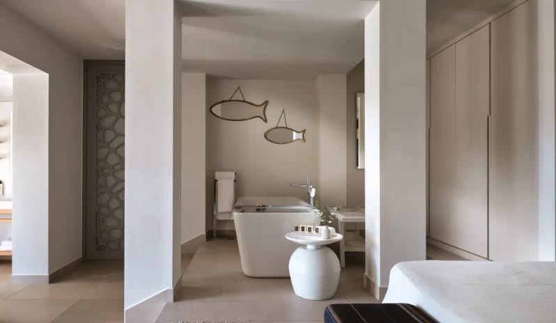 Residential 2 Bedroom Pool Villa Private Garden Sea View white standalone soaking tub, decorative fish-shaped wall mirrors, and minimalist Mediterranean interior design at Eagles Villas by Kenwood Travel