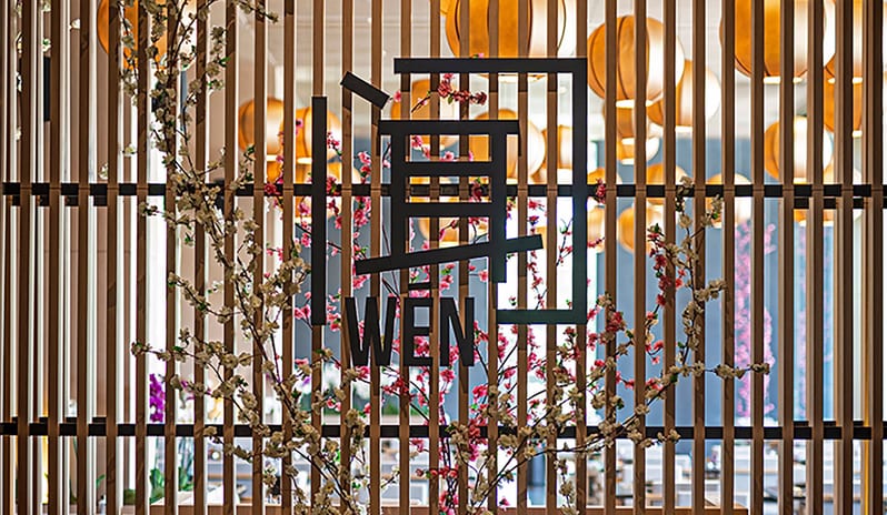 Gracias Mexican Restaurant Wen Chinese Restaurant featuring a wooden slat wall, cherry blossom decor, and backlit circular lanterns at Voyage Belek Golf & Spa by Kenwood Travel