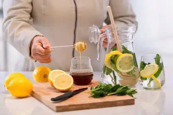 Spa Vitamin Bar Luxury spa vitamin bar featuring infused detox water, fresh lemons, and mint for a healthy guest experience at Liberty Signa Hotel by Kenwood Travel