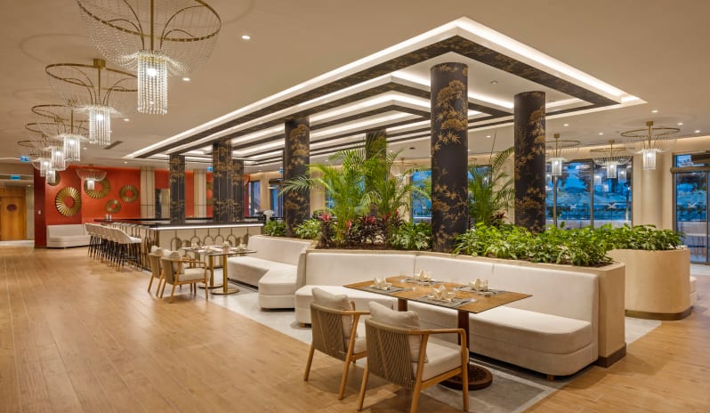 Miyabi A’la Carte Restaurant modern Japanese restaurant interior featuring luxury booth seating, ornate black and gold pillars, and crystal chandeliers at Liberty Signa Hotel by Kenwood Travel