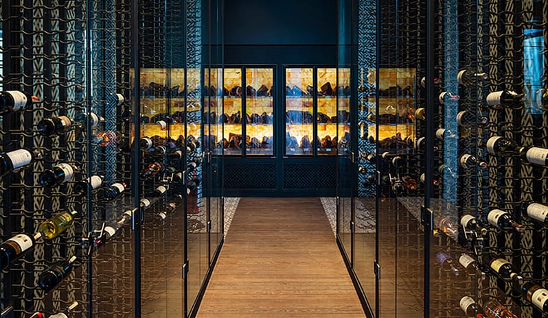 Carino Steak Restaurant Modern wine cellar and dry-aging meat display at Voyage Belek Golf & Spa by Kenwood Travel