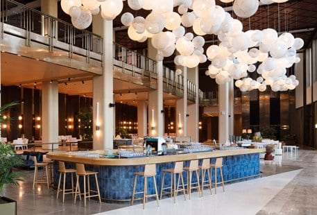 Patisserie Bar large white cloud-like spherical light installation and high-ceiling architecture at Voyage Belek Golf & Spa by Kenwood Travel