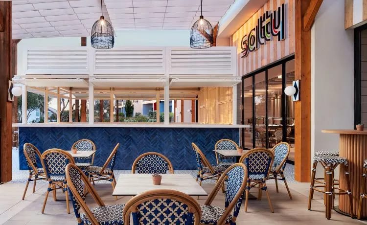 Salty blue herringbone tile decor and bistro-style seating at Tivoli Alvor Algarve by Kenwood Travel