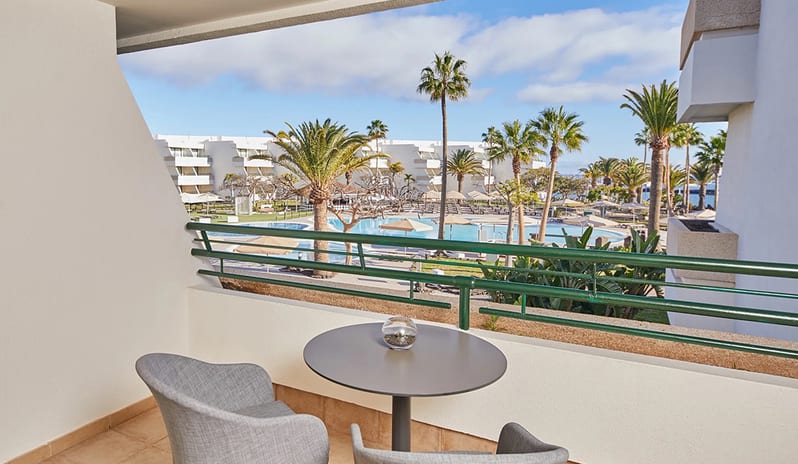 Terrace with pool view at Dreams Lanzarote Playa Dorada Resort & Spa - Resort in Europe - holidays by Kenwood Travel