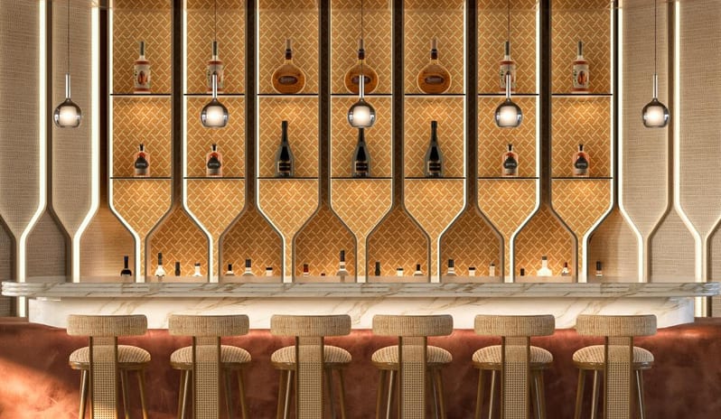Lobby Bar sophisticated hotel bar featuring a marble-topped counter, warm ambient lighting, and high-end spirit selection in a Mediterranean luxury setting at Costa Ragusa Borgo & Resort by Kenwood Travel