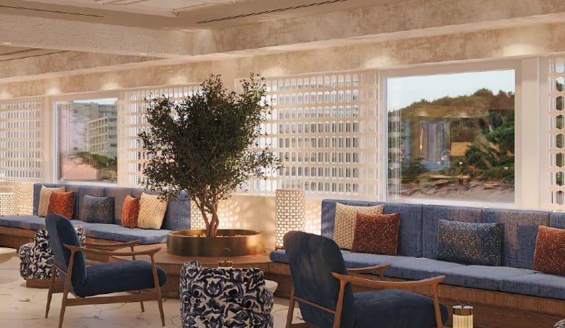 Fine Dining Restaurant blue velvet seating, marble floors, a central olive tree, and decorative Mediterranean latticework at Costa Ragusa Borgo & Resort by Kenwood Travel