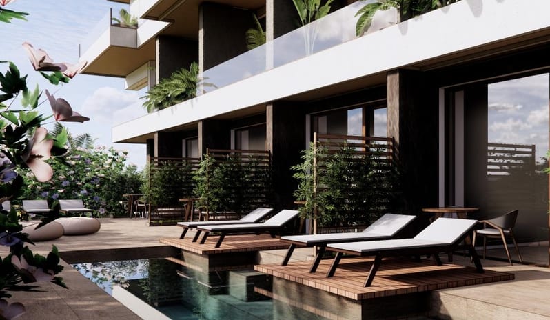 Suite Swim Up Private sun loungers on a wooden platform over a clear blue swimming pool at a luxury Mediterranean-style resort at Costa Ragusa Borgo & Resort by Kenwood Travel