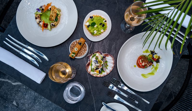The Rose artistic plating with fresh herbs and edible flowers at Grecotel LUXME Dama Dama by Kenwood Travel