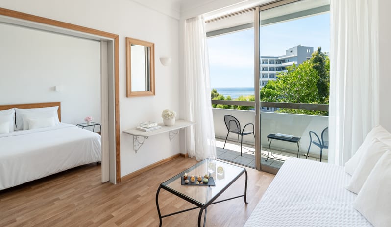 Premier Family Guestroom Side Sea View Luxury family guestroom with balcony and Mediterranean sea view at Grecotel LUXME Dama Dama by Kenwood Travel