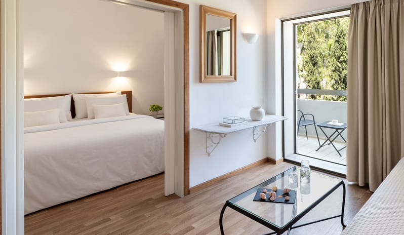 Family Guestroom Inland View separate bedroom, living area, and private balcony with inland view at Grecotel LUXME Dama Dama by Kenwood Travel