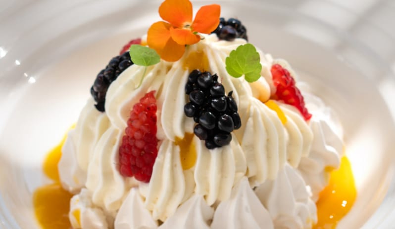 Patisserie & Chocolaterie featuring a fresh berry meringue and citrus sauce at Grecotel LUXME Dama Dama by Kenwood Travel