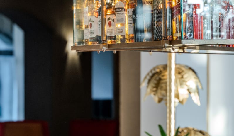 Patisserie & Chocolaterie featuring a decorative lizard sculpture and elegant glassware at Grecotel LUXME Dama Dama by Kenwood Travel