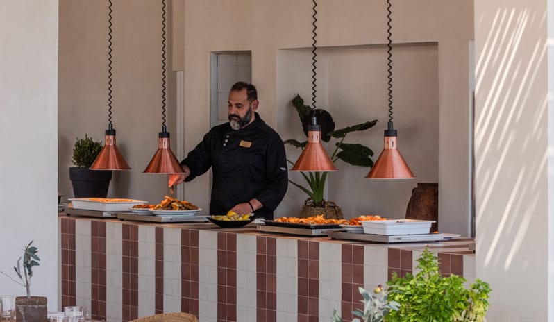 Tavernaki A professional chef preparing food at Grecotel LUXME Dama Dama by Kenwood Travel