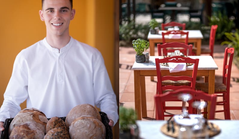 Tavernaki A smiling waiter holding a basket of fresh artisanal bread at Grecotel LUXME Costa Botanica by Kenwood Travel at Grecotel LUXME Costa Botanica by Kenwood Travel