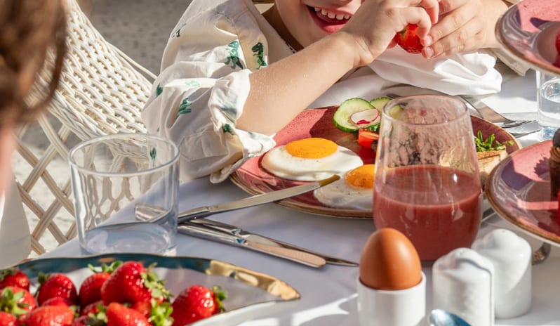 Mediterranea Child enjoying a healthy breakfast menu at Grecotel LUXME Costa Botanica by Kenwood Travel