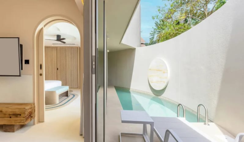 One Bedroom Pool Villa Luxury one-bedroom pool villa showing an open sliding glass door that connects the indoor suite to a private outdoor plunge pool with a sun lounger at Centara Karon Villas Phuket by Kenwood Travel