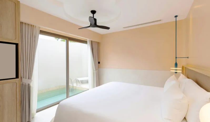 Two Bedroom Pool Villa two-bedroom pool villa featuring a king bed with crisp white linens, sliding glass doors opening directly to a private outdoor pool, and elegant neutral decor at Centara Karon Villas Phuket by Kenwood Travel
