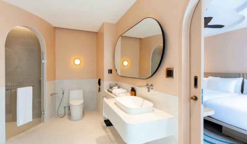 Two Bedroom Pool Villa Modern ensuite bathroom in a luxury two-bedroom pool villa with a sleek vanity mirror, walk-in shower, and contemporary finishes at Centara Karon Villas Phuket by Kenwood Travel