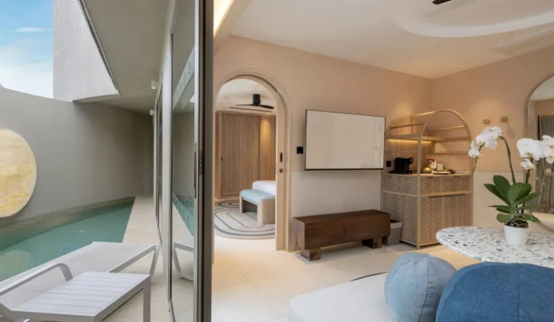 Three Bedroom Pool Villa private plunge pool with lounge chairs alongside an indoor living space with a minibar setup and bedroom view at Centara Karon Villas Phuket by Kenwood Travel
