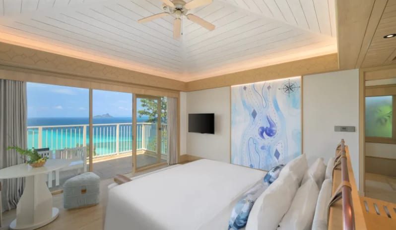 Villa Ocean View Luxury ocean view villa bedroom with private balcony and coastal accent wall at Centara Villas Phi Phi Island by Kenwood Travel