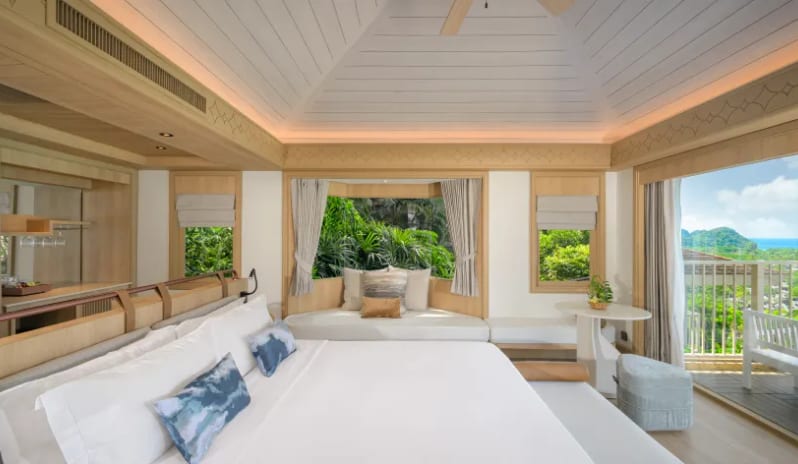 Villa Ocean View Luxury villa bedroom with a built-in daybed, garden view windows, and private balcony at Centara Villas Phi Phi Island by Kenwood Travel