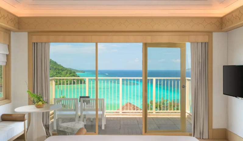 Villa Ocean View Private balcony terrace of an upscale tropical resort suite featuring an outdoor table, chairs, and stunning ocean vistas at Centara Villas Phi Phi Island by Kenwood Travel