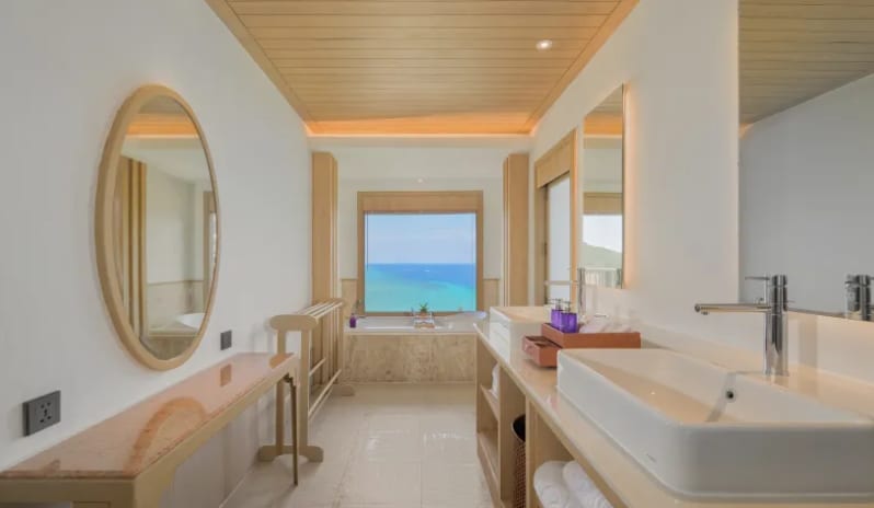 Villa Ocean View Luxury resort villa bathroom with double vanity and ocean view bathtub at Centara Villas Phi Phi Island by Kenwood Travel