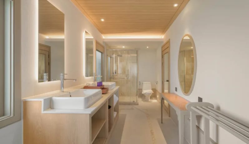 Villa Ocean View Luxury villa bathroom with double vanity and glass walk-in shower at Centara Villas Phi Phi Island by Kenwood Travel