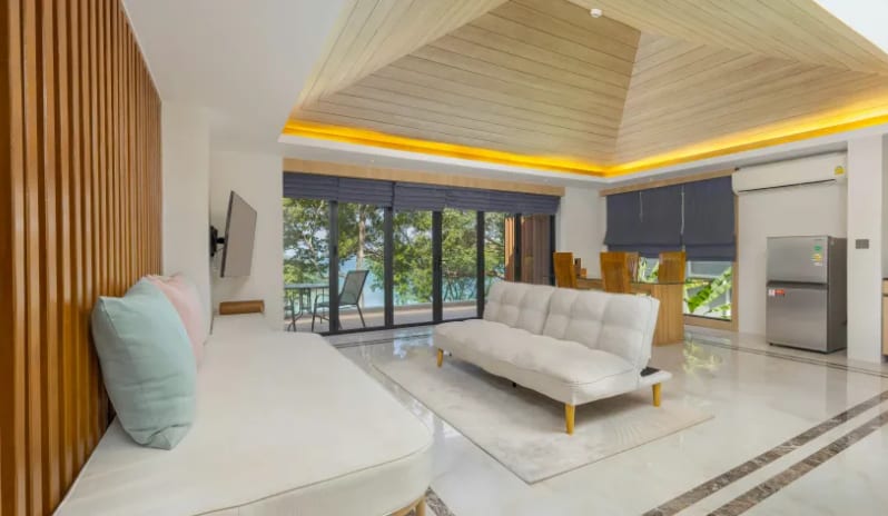 Duplex Suite Spa Ocean View Luxury hotel duplex suite open-plan lounge, dining table, and balcony at Centara Villas Phi Phi Island by Kenwood Travel