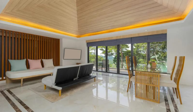 Duplex Suite Spa Ocean View Modern hotel duplex suite living room with polished marble floors, contemporary furniture, and a private balcony view at Centara Villas Phi Phi Island by Kenwood Travel