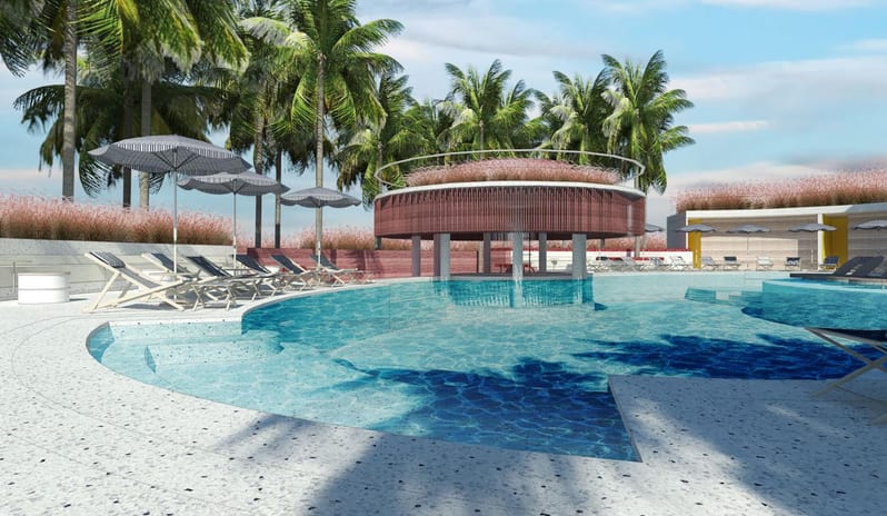 Splash The outdoor swimming pool at Centara Karon Resort Phuket, featuring a central water feature, sun loungers with umbrellas, and surrounding palm trees at Centara Karon Villas Phuket by Kenwood Travel