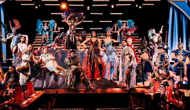 Sala Scala Gran Canaria View from a dinner table of a live stage production featuring singers and dancers in fantasy-themed outfits at Paradisus Gran Canaria by Kenwood Travel