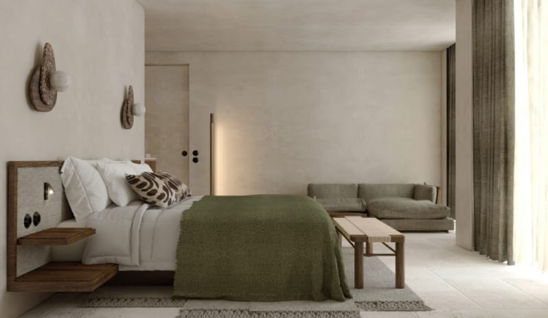 Deluxe Suite Modern minimalist bedroom with textured beige walls, a bed featuring a forest green throw, and a low wooden bench at the foot at OKU Bodrum by Kenwood Travel