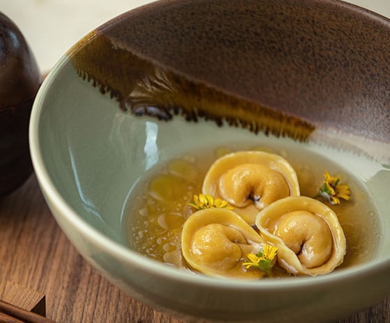Earth Close-up of an elegant pasta dish in a two-tone glazed stoneware bowl, showcasing minimalist food styling and organic textures at Earth Restaurant at Kuda Villingili Resort Maldives by Kenwood Travel