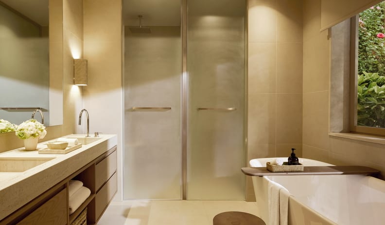 Deluxe Double Room Private Garden Sea View spacious luxury resort bathroom with warm beige tiles at Sani Club by Kenwood Travel
